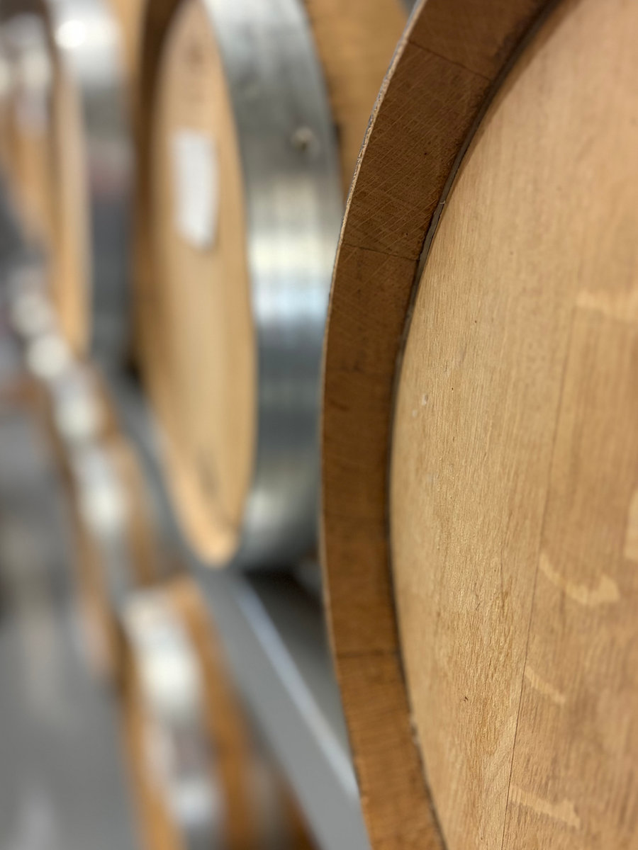 Oak barrels, shown as distillery mood photography