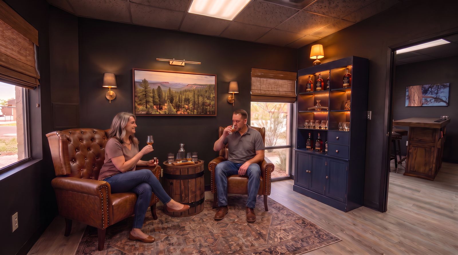 Concept render of the Happy Jack lounge room: leather armchairs, a barrel table with a tasting flight, and a lit bottle cabinet